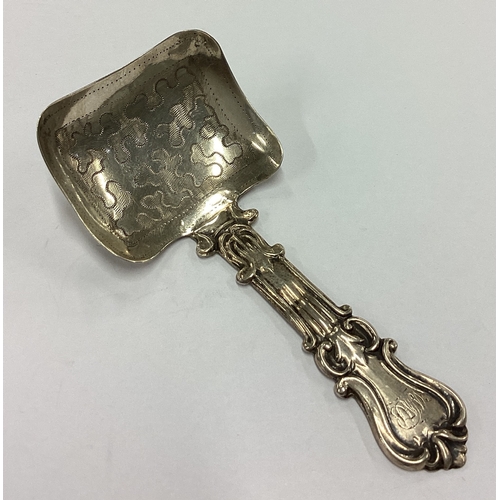 271 - A Victorian silver bright-cut shovel shaped caddy spoon. Birmingham 1845. By George Unite. Approx. 9... 