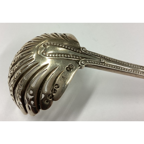 280 - A heavy Victorian silver sifter spoon with pierced bowl. London 1876. By George Adams. Approx. 42 gr... 