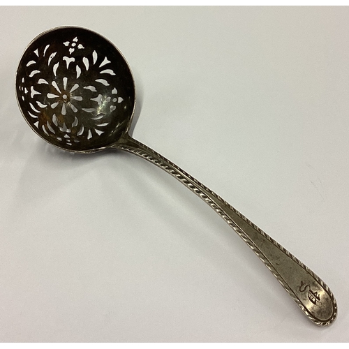 282 - NEWCASTLE: A rare 18th Century silver sifter spoon with pierced bowl. Maker's mark 'IL' struck twice... 