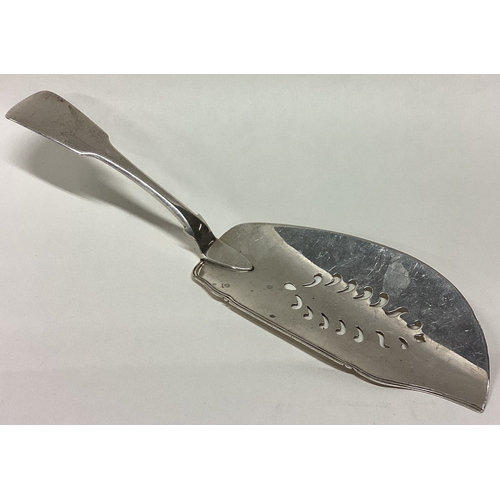 285 - EXETER: An unusual fiddle pattern silver fish slice. 1828. By Isaac Parkin. Approx. 133 grams. Est. ... 