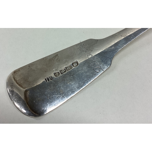 285 - EXETER: An unusual fiddle pattern silver fish slice. 1828. By Isaac Parkin. Approx. 133 grams. Est. ... 