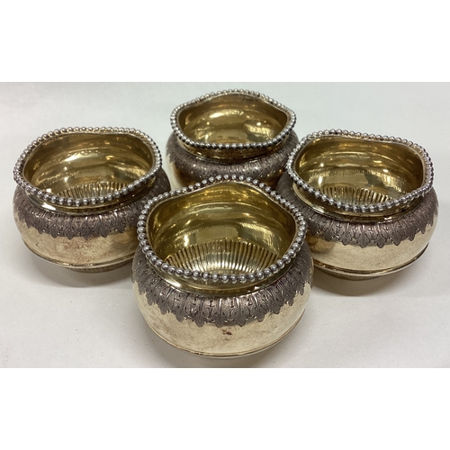 286 - A good set of four silver gilt salts with beadwork border. London. Approx. 200 grams. Est. £100 - £1... 