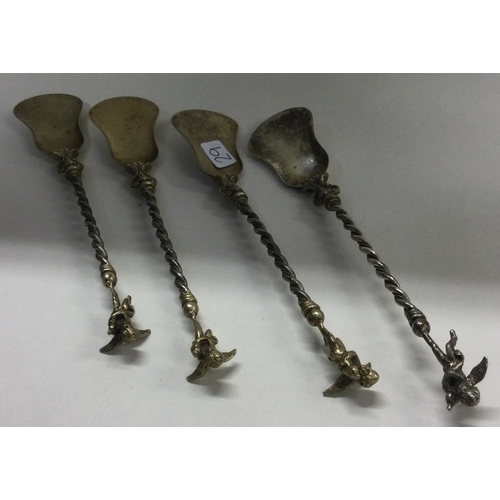 29 - A set of four silver figural ice cream spoons. Approx. 56 grams. Est. £50 - £80.