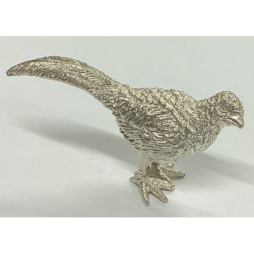 305 - A heavy cast silver figure of a pheasant with textured body. Birmingham. Approx. 33 grams. Est. £30 ... 