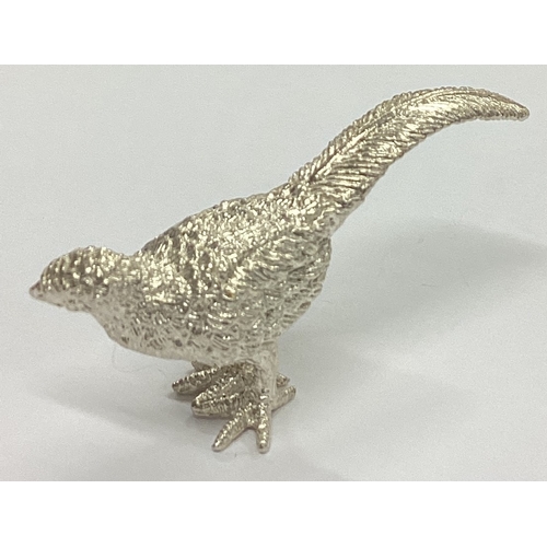 305 - A heavy cast silver figure of a pheasant with textured body. Birmingham. Approx. 33 grams. Est. £30 ... 