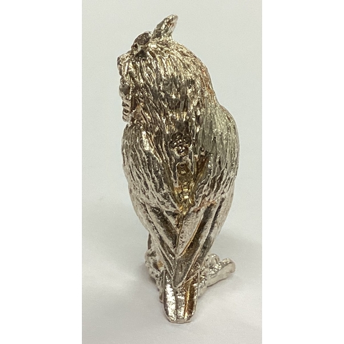 307 - A small heavy figure of an owl with textured body. London. By CH. Approx. 18 grams. Est. £20 - £30.