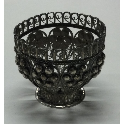 32 - A filigree silver egg cup. Approx. 39 grams. Est. £40 - £60.