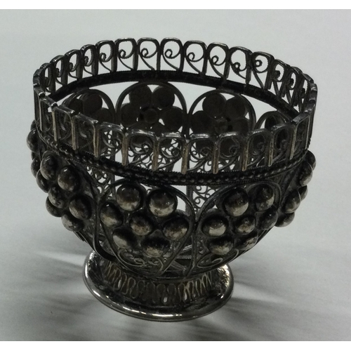 32 - A filigree silver egg cup. Approx. 39 grams. Est. £40 - £60.