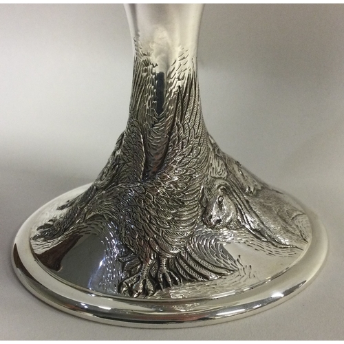 337 - A rare and unusual chased silver goblet embossed with horses and stags to body, and embossed crowned... 