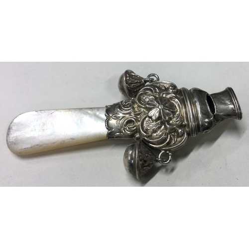 350 - A silver and MOP rattle. Birmingham 1912. Approx. 21 grams. Est. £20 - £30.