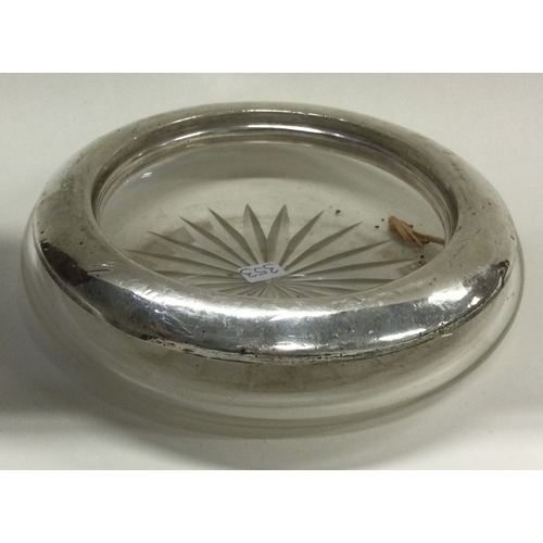 353 - A large silver and glass butter dish. Est. £20 - £30.