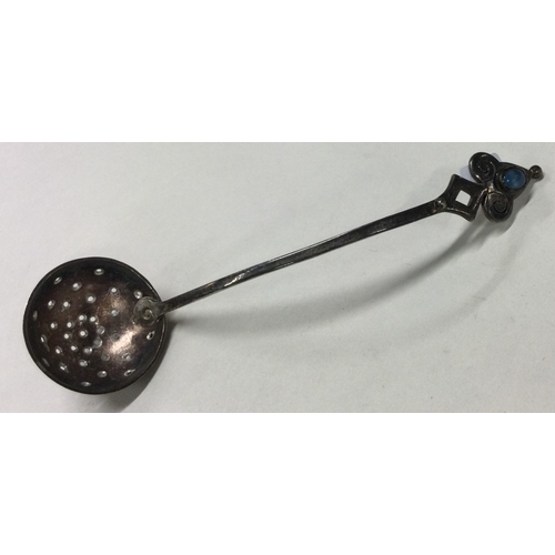 358 - A rare Arts and Crafts silver sifter spoon with blue stone to handle. Marked to base. Approx. 13 gra... 