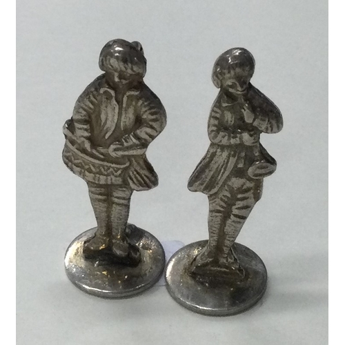 362 - A pair of silver figural menu holders. Approx. 14 grams. Est. £20 - £30.