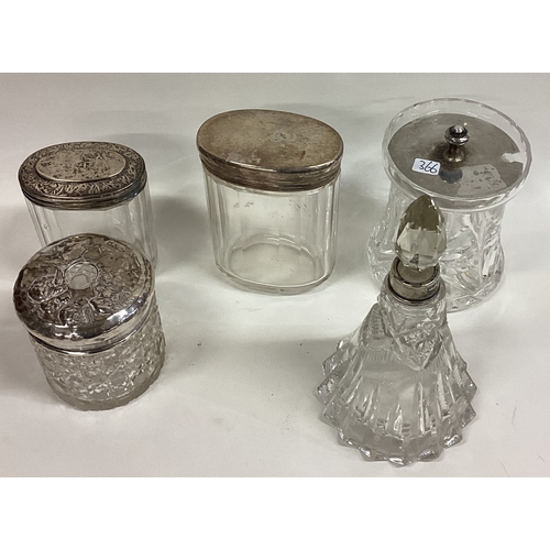 366 - A silver mounted glass preserve jar together with numerous silver mounted scent bottles. Various dat... 