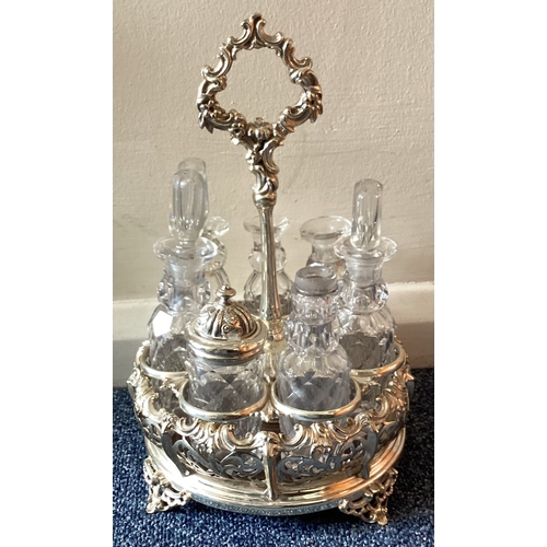 384 - A silver plated and cut-glass cruet set. Est. £20 - £30.