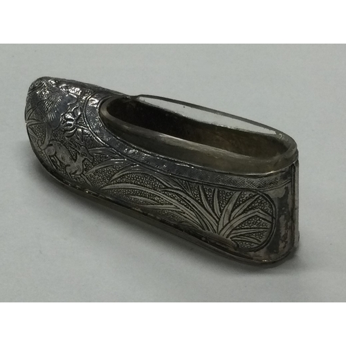 39 - An early 20th Century Chinese export silver shoe with clear glass liner. By Sing Fat. Approx. 24 gra... 