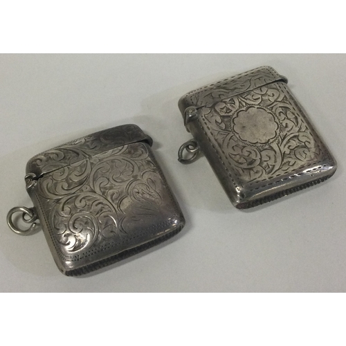 393 - Two engraved silver vesta cases with hinged tops. Approx. 46 grams. Est. £20 - £30.