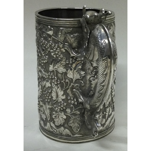 405 - A rare Chinese export silver mug embossed with grapes, vines and dragon handle. Character marks to b... 