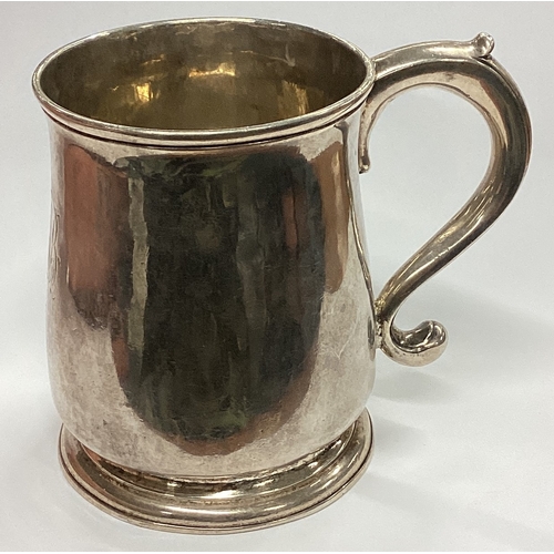 409 - A good George II tapering silver mug of typical form on pedestal foot. London 1733. By KB. Approx. 2... 