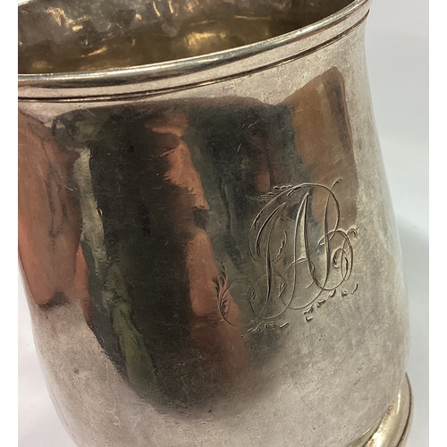 409 - A good George II tapering silver mug of typical form on pedestal foot. London 1733. By KB. Approx. 2... 