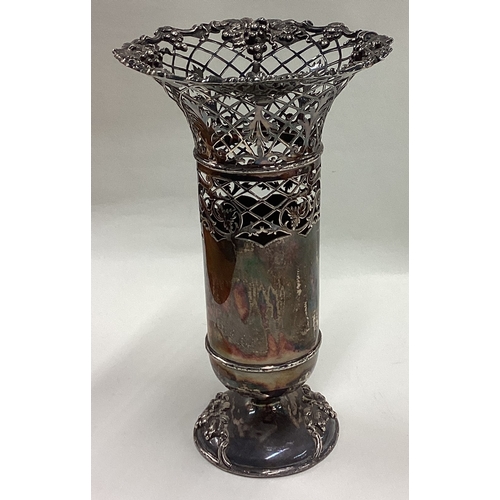 410 - A good pierced silver spill vase attractively decorated with vines to circular pedestal base. Sheffi... 