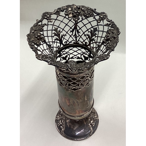 410 - A good pierced silver spill vase attractively decorated with vines to circular pedestal base. Sheffi... 