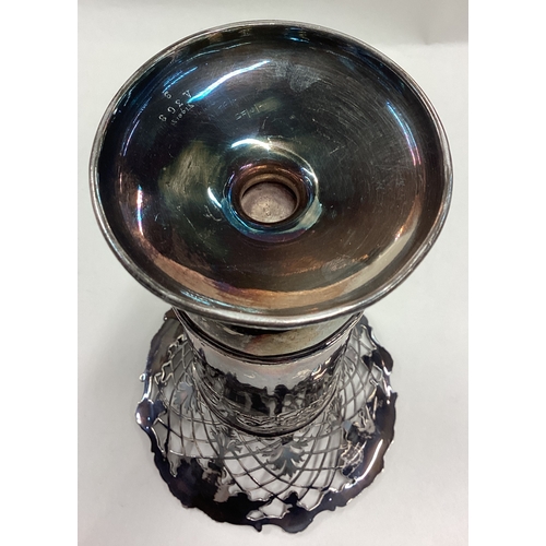 410 - A good pierced silver spill vase attractively decorated with vines to circular pedestal base. Sheffi... 