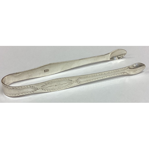 446 - HESTER BATEMAN: A pair of silver sugar tongs. London circa 1790. Approx. 32 grams. Est. £50 - £80.