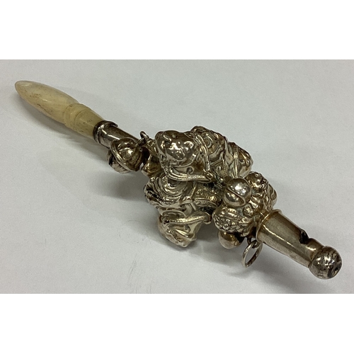 448 - A rare silver figural rattle with MOP handle. Approx. 27 grams. Est. £50 - £80.