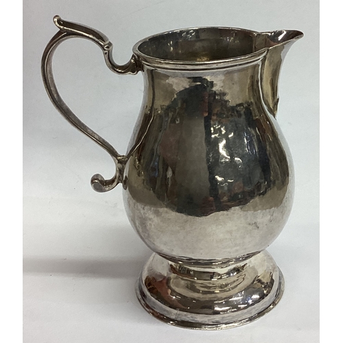 478 - An 18th Century George II silver pitcher / jug. Lion mark to base. Approx. 83 grams. Est. £200 - £30... 