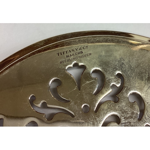 480 - TIFFANY & CO: An oversized silver tea strainer. Approx. 89 grams. Est. £100 - £150.