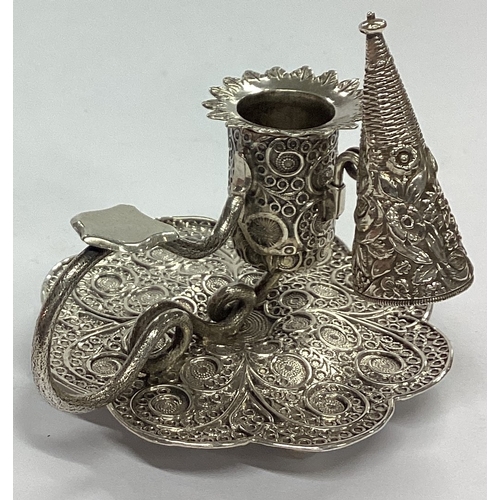 5 - A fine quality miniature silver chamberstick with filigree decoration and matching extinguisher. Bir... 