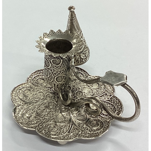 5 - A fine quality miniature silver chamberstick with filigree decoration and matching extinguisher. Bir... 