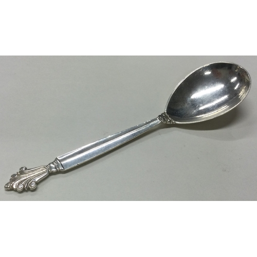 55 - GEORG JENSEN: A large Danish silver caddy spoon. Marked to back. Approx. 34 grams. Est. £40 - £60.