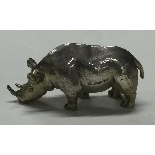 56 - A heavy silver figure of a rhino. London 2001. Approx. 131 grams. Est. £150 - £200.