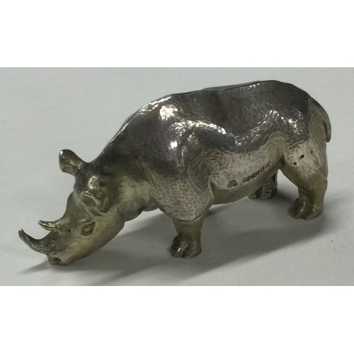 56 - A heavy silver figure of a rhino. London 2001. Approx. 131 grams. Est. £150 - £200.