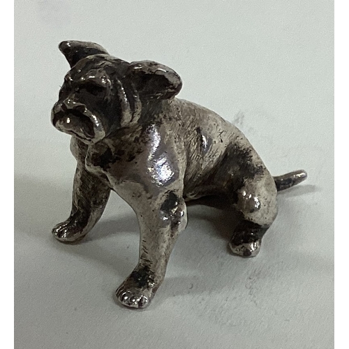 570 - A silver figure of a pug dog bearing import marks. Approx. 19 grams. Est. £40 - £60.