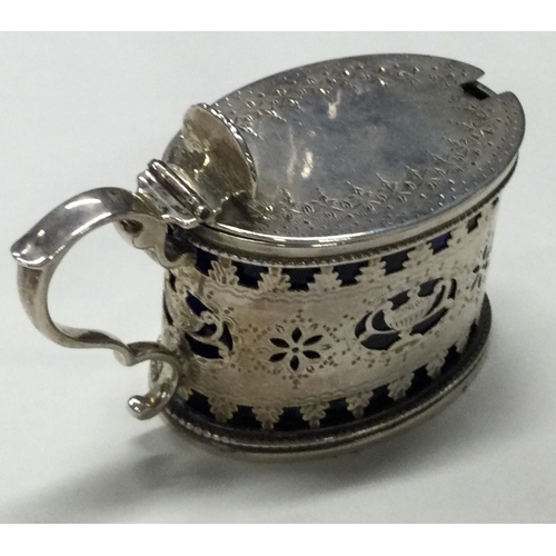 64 - A Victorian silver mustard pot with pierced decoration. London 1883. By Joseph Angel. Approx. 100 gr... 