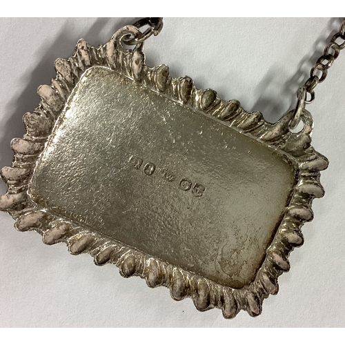 67 - A good rectangular silver wine label for 'Madeira'. London. By JW. Approx. 10 grams. Est. £30 - £50.