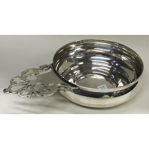 78 - TIFFANY & CO: A silver wine taster. Marked to base. Approx. 239 grams. Est. £250 - £300.