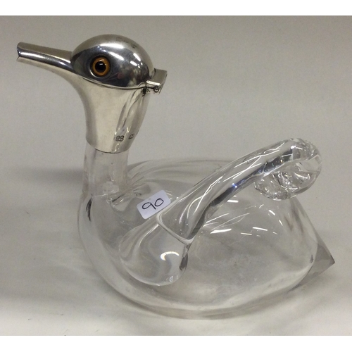 90 - A novelty Victorian silver and glass claret jug in the form of a duck. Birmingham 1899. Approx. 352 ... 