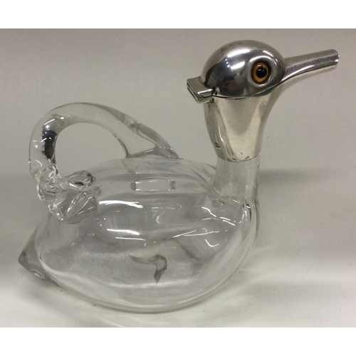 90 - A novelty Victorian silver and glass claret jug in the form of a duck. Birmingham 1899. Approx. 352 ... 