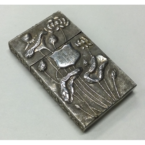 93 - WANG HING: A 19th Century Chinese chased silver card case embossed with flowers to lift-off cover. M... 