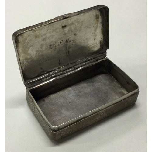 95 - A 19th Century silver hinged snuff box with engraved decoration. Approx. 82 grams. Est. £80 - £120.