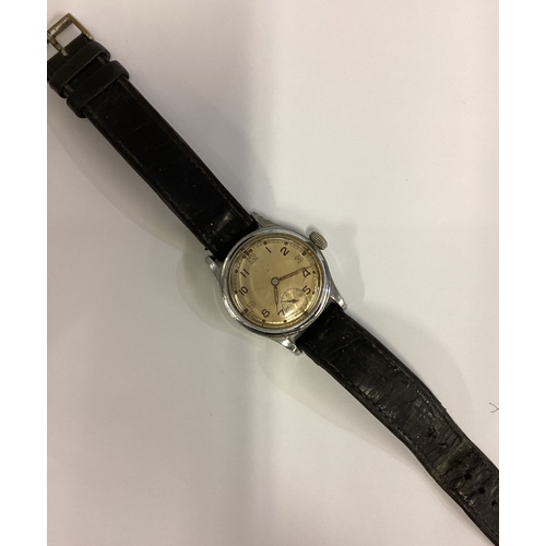 950 - A gent's stainless steel Military watch with silvered dial on leather strap. Est. £30 - £50.