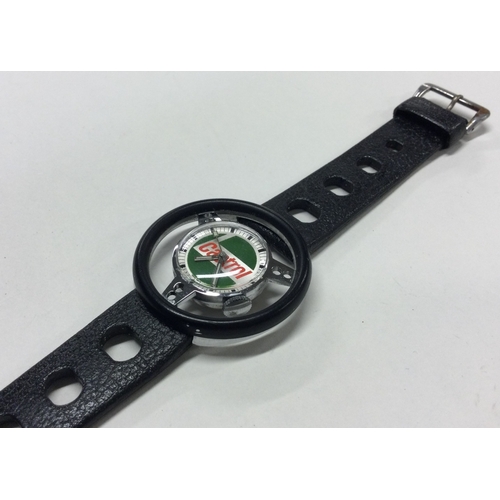 953 - TROPIC: A gent's stainless steel Castrol wristwatch on black strap in the form of a race car steerin... 