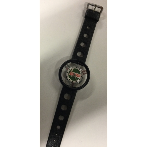 953 - TROPIC: A gent's stainless steel Castrol wristwatch on black strap in the form of a race car steerin... 