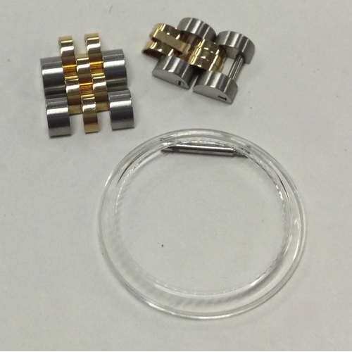 954 - ROLEX: Two bi-metal watch links. Approx. 5 grams. Est. £30 - £50.