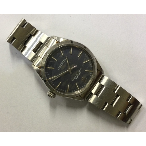 958 - ROLEX: A gent's Oyster Perpetual wristwatch with blue dial on stainless steel strap. Numbered to str... 