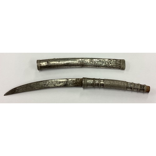 382 - A rare 19th Century Asian silver sword with lift-off sleeve. Approx. 10 grams. Est. £30 - £50.